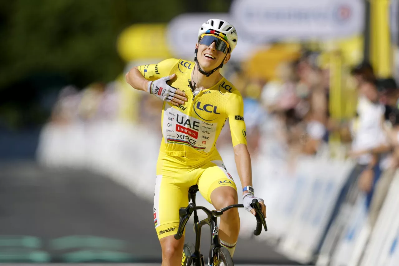 LE LIORAN (France), 14/07/2026.- Yellow Jersey overall leader Slovenian cyclist Tadej Pogacar of UAE Team Emirates XRG celebrates as he crosses the finish line to win Stage 10 of the Tour de France, a 166.6 km route from Aurillac to Le Lioran, France, 14 July 2026. (Ciclismo, Francia) EFE/EPA/GUILLAUME HORCAJUELO
