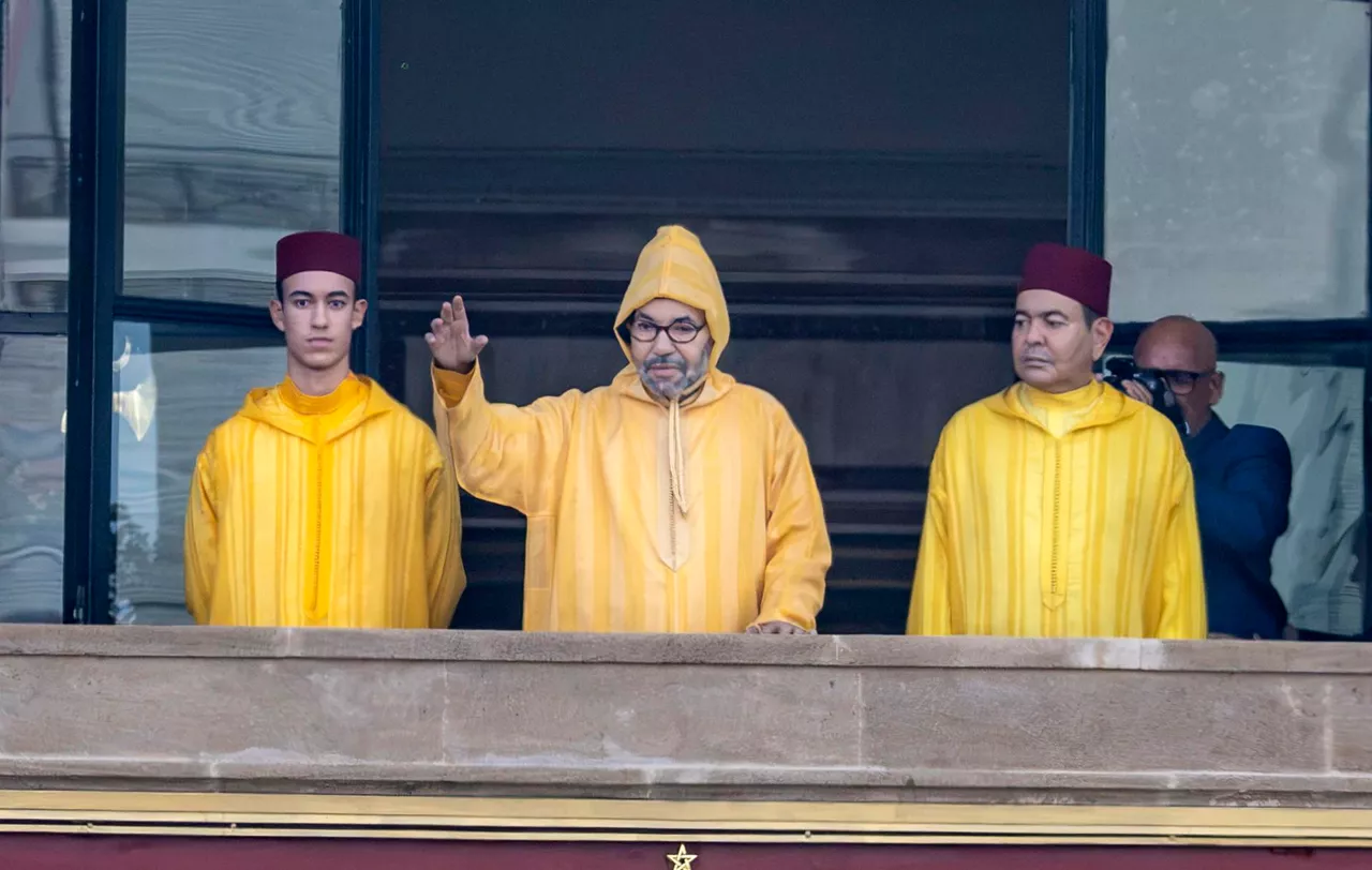 RABAT (Morocco), 09/10/2026.- King Mohammed VI of Morocco (C), accompanied by his son, Crown Prince Moulay El Hassan (L), and his brother, Prince Moulay Rachid (R), appears on the balcony of the Parliament building in Rabat, Morocco, 09 October 2026. King Mohammed VI will preside over the opening of the first session of the first legislative year of the twelfth legislative term. (Marruecos) EFE/EPA/JALAL MORCHIDI
