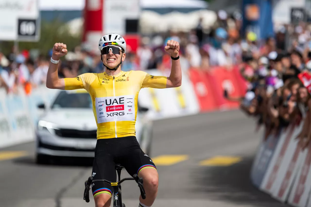 CHARMEY (Switzerland), 02/05/2026.- Winner Tadej Pogacar from Slovenia of UAE Team Emirates XRG raises his arms after crossing the finish line to win the fourth stage, a 149,6 km race between Broc and Charmey at the 79th Tour de Romandie UCI World Tour Cycling race, in Charmey, Switzerland, 02 May 2026. (Ciclismo, Eslovenia, Suiza) EFE/EPA/JEAN-CHRISTOPHE BOTT
