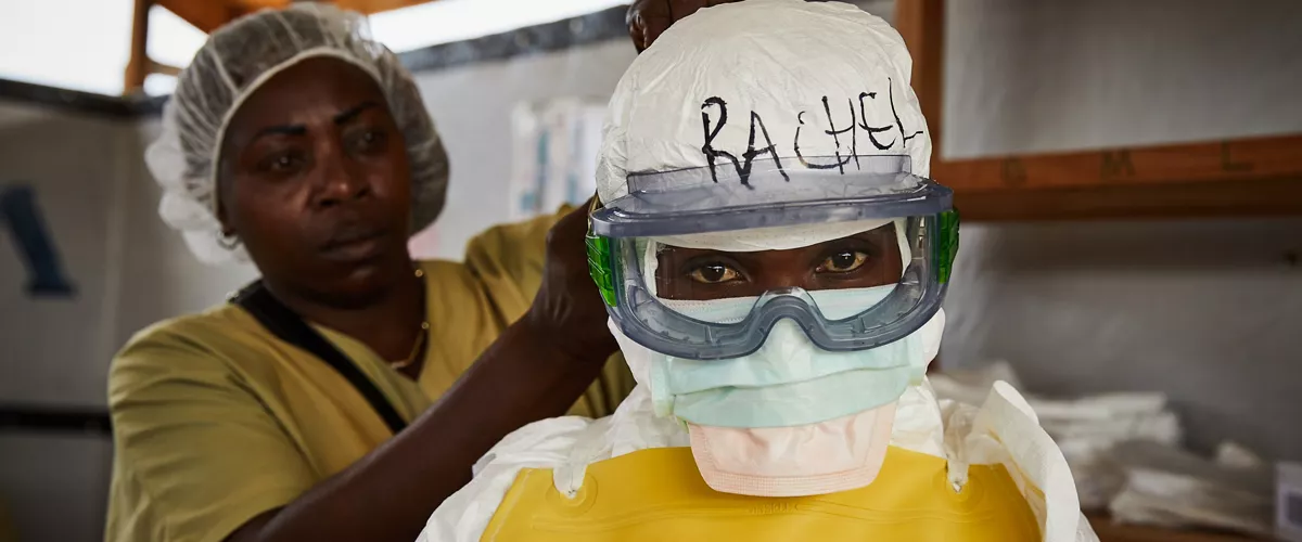 BENI (Congo, the Democratic Republic of the), 12/05/2026.- (FILE) - Rachel Rukwati suits up in PPE to enter a high-risk treatment zone, at the peak of the Ebola crisis, at a health centre in Beni, North Kivu, Democratic Republic of Congo, 04 May 2019 (reissued 12 May 2026). International Nurses Day (IND) is celebrated annually on 12 May to mark the birth of Florence Nightingale, founder of modern nursing. The day honours the vital contributions nurses make to global healthcare and societies. (Florencia) EFE/EPA/HUGH KINSELLA CUNNINGHAM

