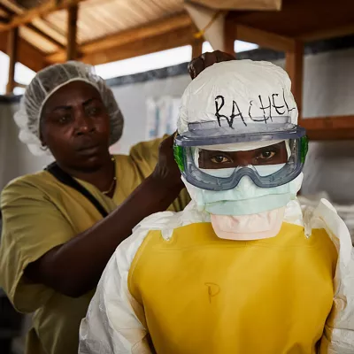 BENI (Congo, the Democratic Republic of the), 12/05/2026.- (FILE) - Rachel Rukwati suits up in PPE to enter a high-risk treatment zone, at the peak of the Ebola crisis, at a health centre in Beni, North Kivu, Democratic Republic of Congo, 04 May 2019 (reissued 12 May 2026). International Nurses Day (IND) is celebrated annually on 12 May to mark the birth of Florence Nightingale, founder of modern nursing. The day honours the vital contributions nurses make to global healthcare and societies. (Florencia) EFE/EPA/HUGH KINSELLA CUNNINGHAM
