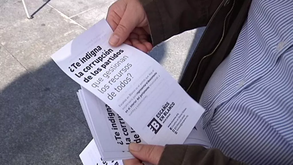 Gizon bat, Escaños en Blancoren propaganda irakutzen, Bilbon. EiTB