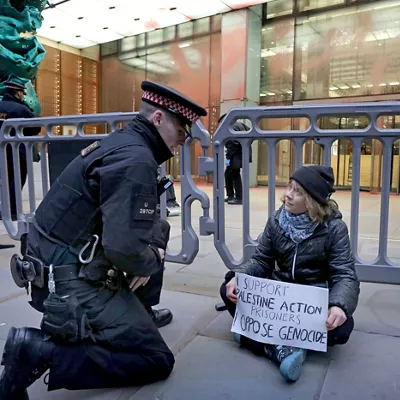 HANDOUT - 23 December 2025, United Kingdom, London: A Handout photo issued by Prisoners for Palestine shows climate activist Greta Thunberg being detained by City of London Police officers during a protest in support of the Palestine Action protesters on hunger strike in prison. Photo: Handout/Prisoners For Palestine/Prisoners for Palestine via PA Media/dpa - ATTENTION: editorial use only in connection with the latest coverage about (the transmission/the film/the auction/the exhibition/the book) and only if the credit mentioned above is referenced in full