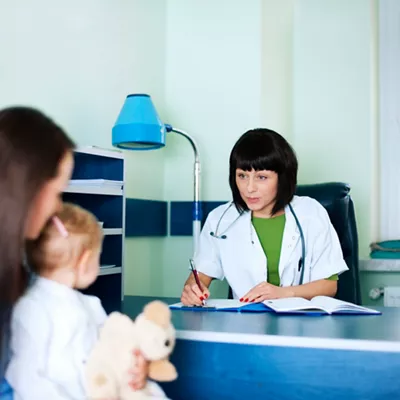 Mother and baby girl at the doctors office